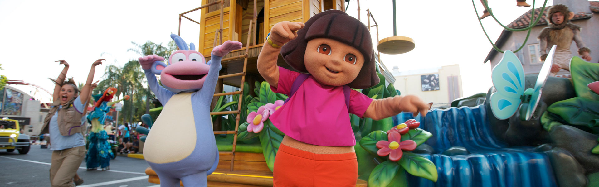 Dora the Explorer and Boots dancing during a parade